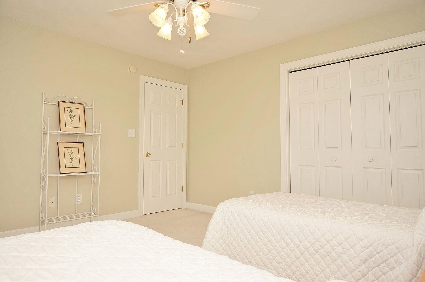 25 Claybrook Court Blue Ridge, VA 24064 - Photo 51 of 81 a bedroom with a large bed and a chandelier