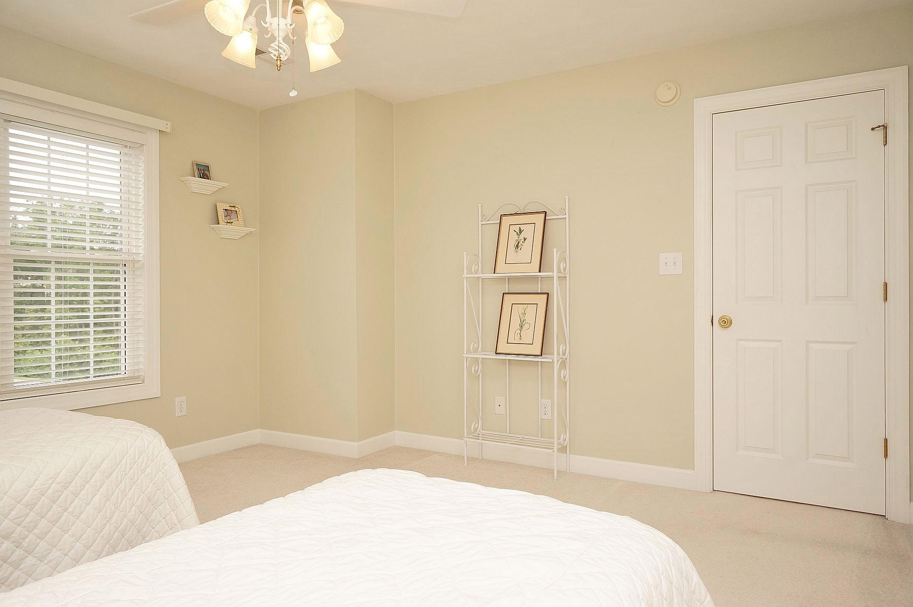 25 Claybrook Court Blue Ridge, VA 24064 - Photo 52 of 81 a bedroom with a bed and a chandelier