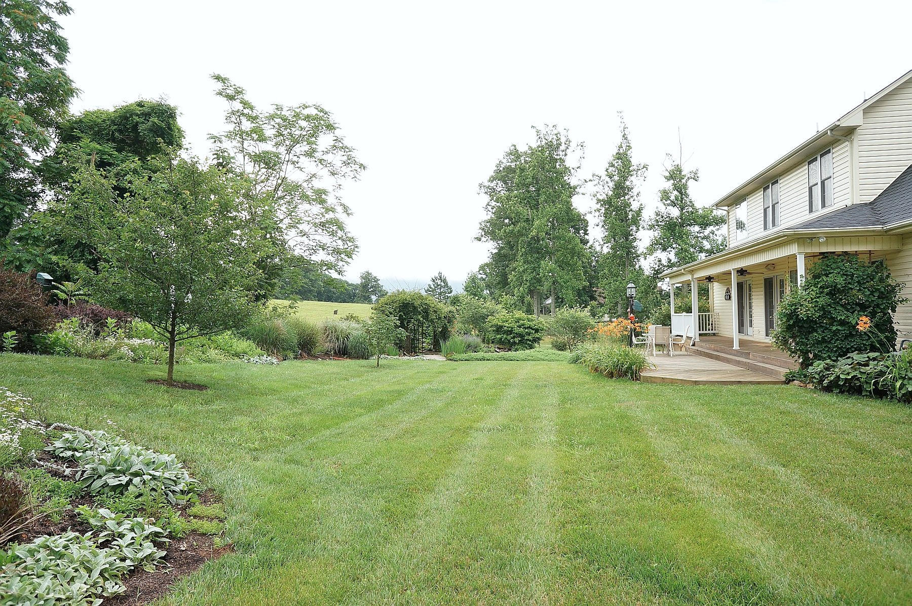 25 Claybrook Court Blue Ridge, VA 24064 - Photo 70 of 81 a view of a house with a big yard and large trees