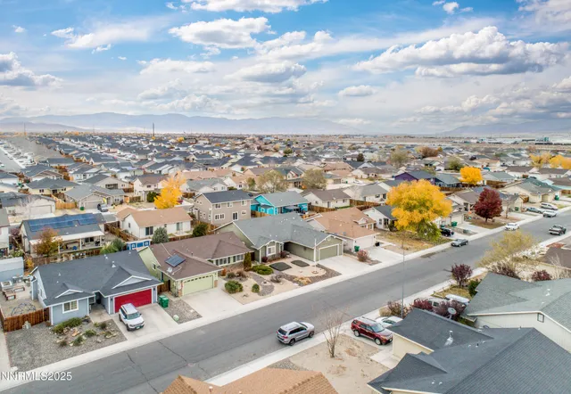 an aerial view of residential houses with outdoor space