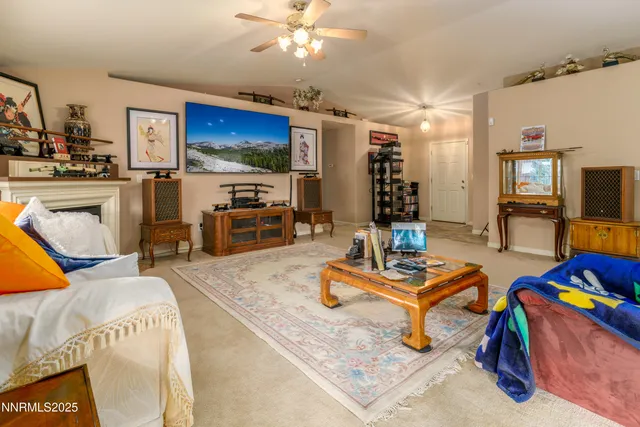a living room with furniture and kitchen view