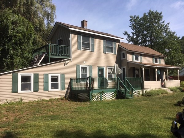 23 Maple Street Chester, MA 01011 - Photo 1 of 11 a front view of a house with a yard