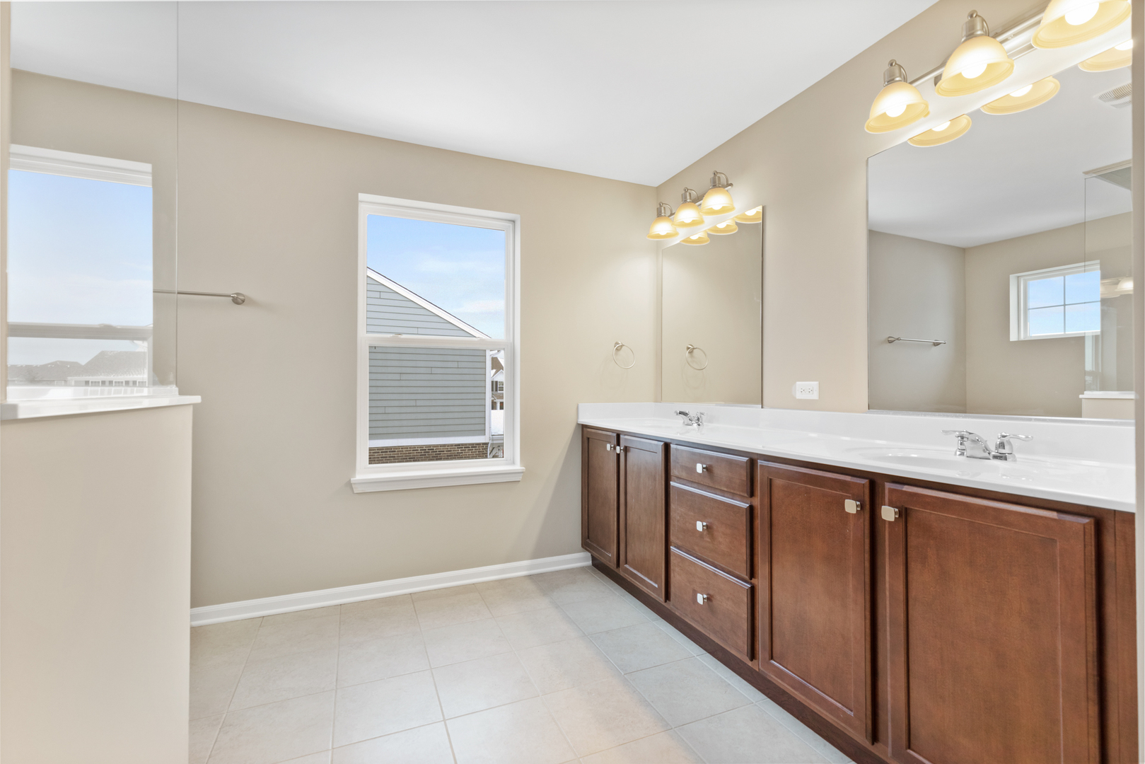 2018 Stapleton Road New Lenox, IL 60451 - Photo 31 of 40 a spacious bathroom with a double vanity sink a large mirror and a shower