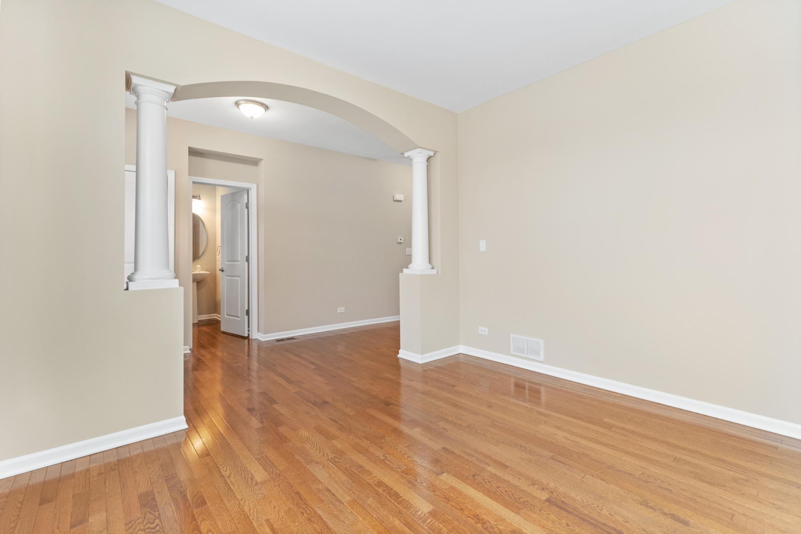 2018 Stapleton Road New Lenox, IL 60451 - Photo 6 of 40 an empty room with wooden floor and mirror
