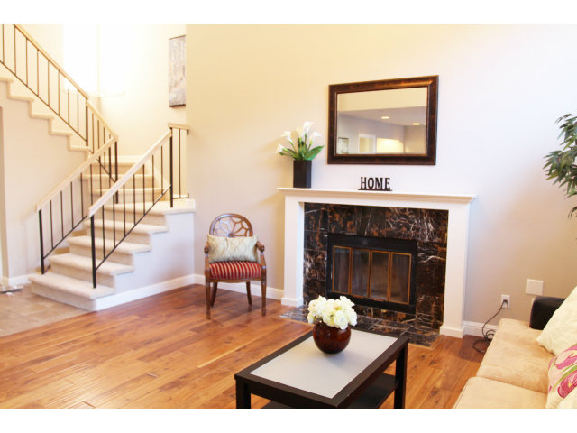 712 Superior Road Milpitas, CA 95035 - Photo 6 of 20 a living room with furniture and a fireplace