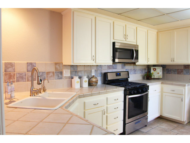 712 Superior Road Milpitas, CA 95035 - Photo 10 of 20 a kitchen with stainless steel appliances granite countertop a sink a stove a microwave and cabinets