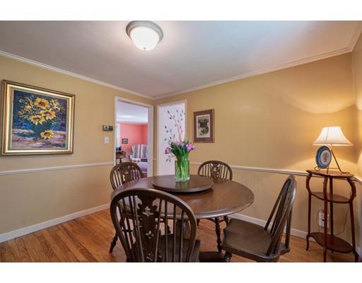 37 Downing Street Hingham, MA 02043 - Photo 5 of 20 a view of a dining room with furniture and a potted plant