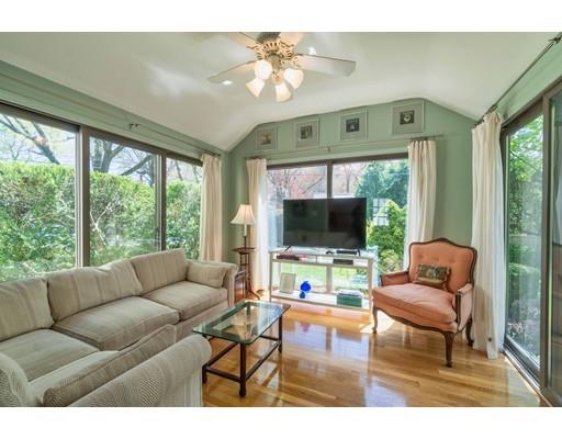 37 Downing Street Hingham, MA 02043 - Photo 8 of 20 a living room with furniture a flat screen tv and a large window
