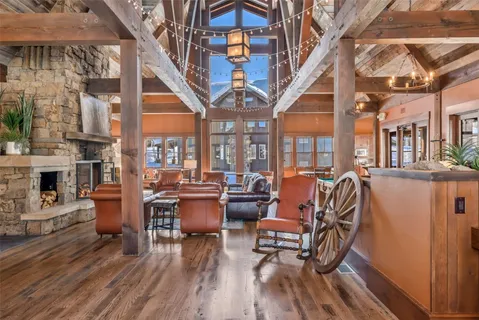 a room with pool table and windows