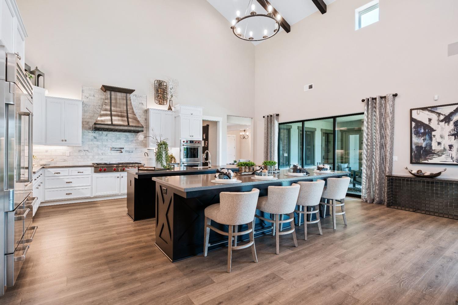 1754 Lester Avenue Clovis, CA 93619 - Photo 12 of 59 a large kitchen with a table and chairs in it