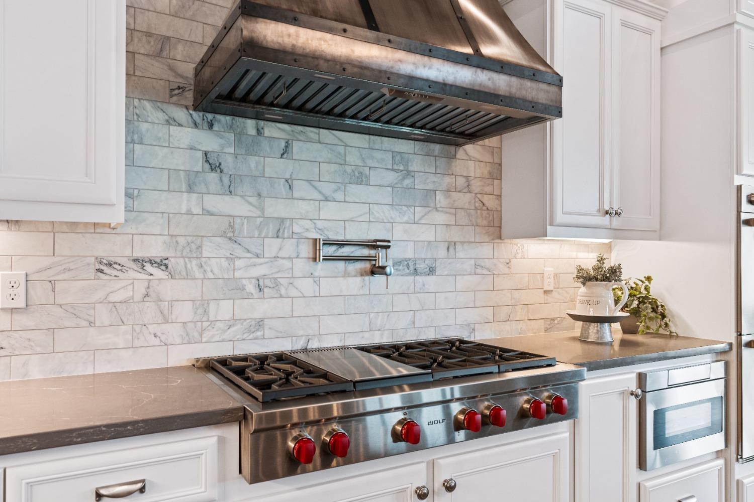 1754 Lester Avenue Clovis, CA 93619 - Photo 15 of 59 a stove top oven sitting inside of a kitchen
