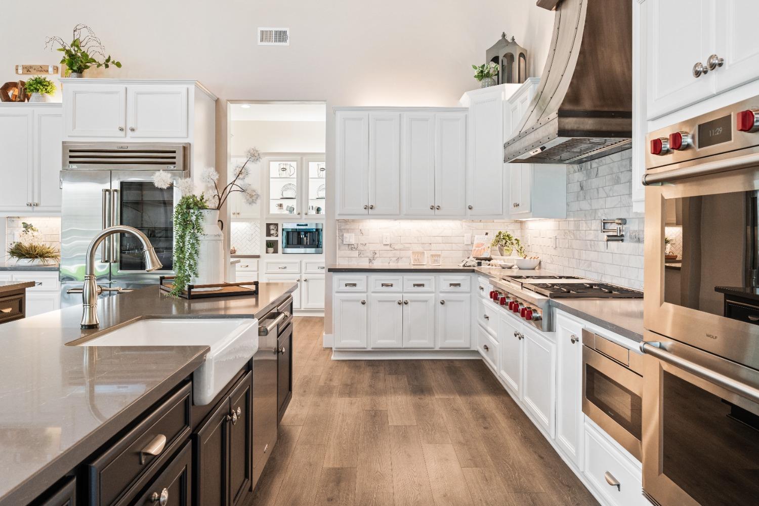 1754 Lester Avenue Clovis, CA 93619 - Photo 19 of 59 a kitchen with stainless steel appliances granite countertop a sink stove and refrigerator