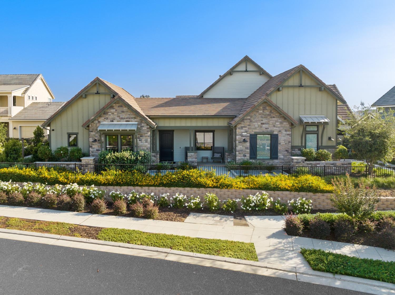 1754 Lester Avenue Clovis, CA 93619 - Photo 2 of 59 a front view of a house with a yard and potted plants