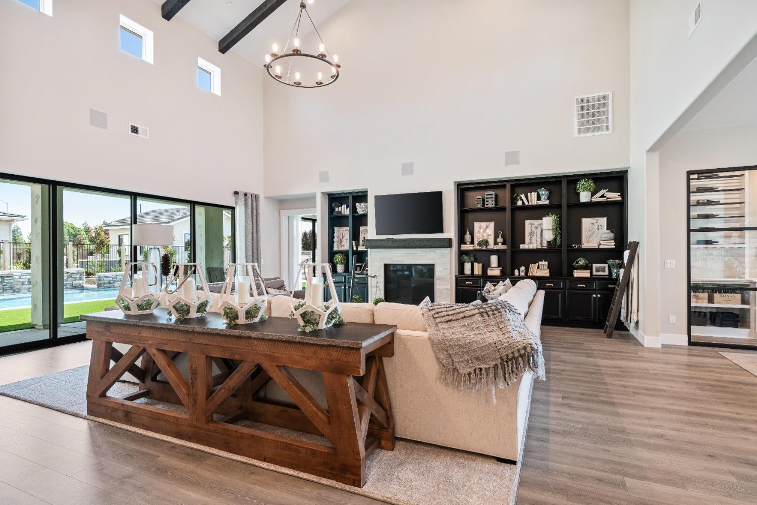 1754 Lester Avenue Clovis, CA 93619 - Photo 21 of 59 a living room with furniture fireplace and flat screen tv