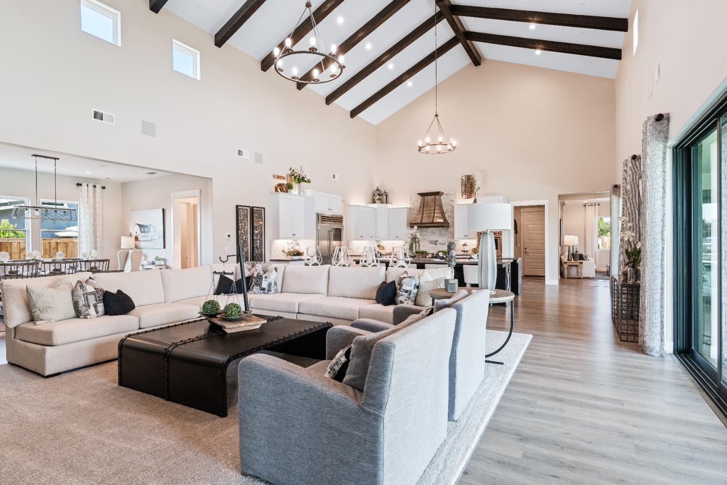 1754 Lester Avenue Clovis, CA 93619 - Photo 22 of 59 a living room with furniture wooden floor and a chandelier