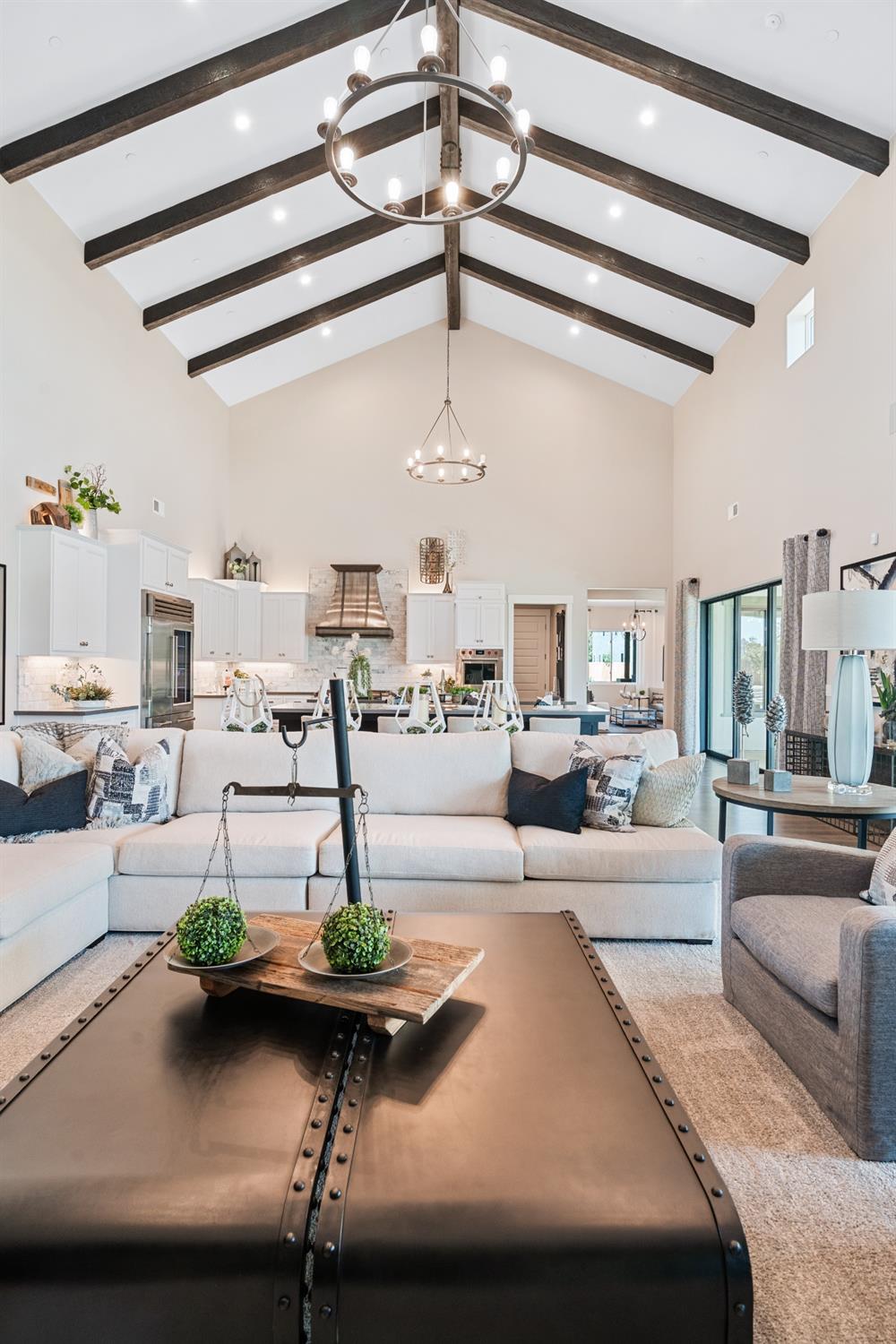 1754 Lester Avenue Clovis, CA 93619 - Photo 23 of 59 a living room with furniture and a chandelier