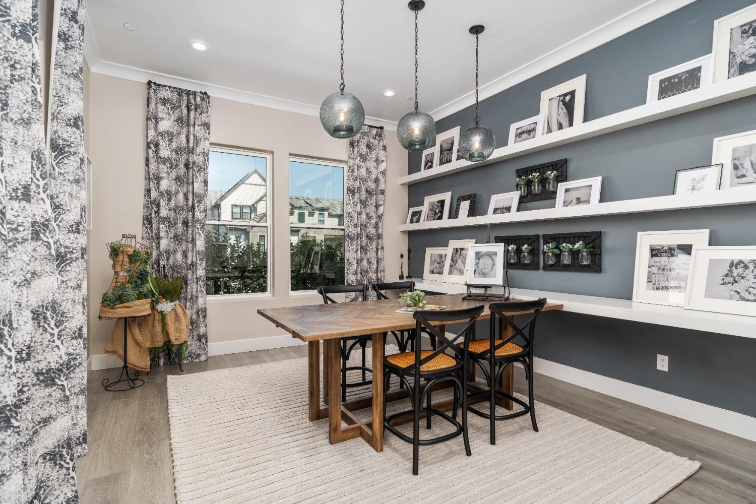 1754 Lester Avenue Clovis, CA 93619 - Photo 26 of 59 a view of a dining room and livingroom with furniture wooden floor a rug a potted plant and a chandelier