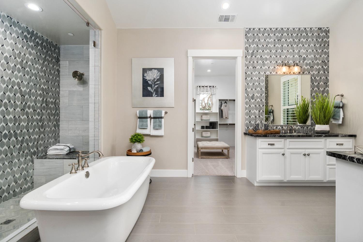 1754 Lester Avenue Clovis, CA 93619 - Photo 28 of 59 a en suite bathroom with double vanity and a mirror