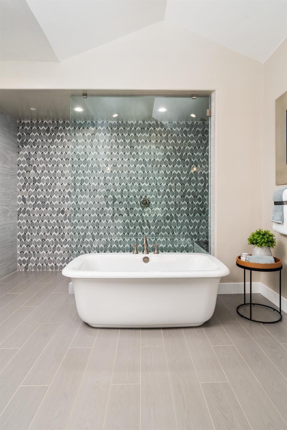 1754 Lester Avenue Clovis, CA 93619 - Photo 30 of 59 a bathroom with a bathtub and shower