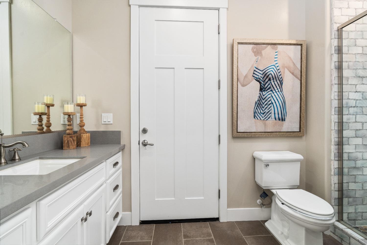 1754 Lester Avenue Clovis, CA 93619 - Photo 32 of 59 a bathroom with a toilet sink and mirror