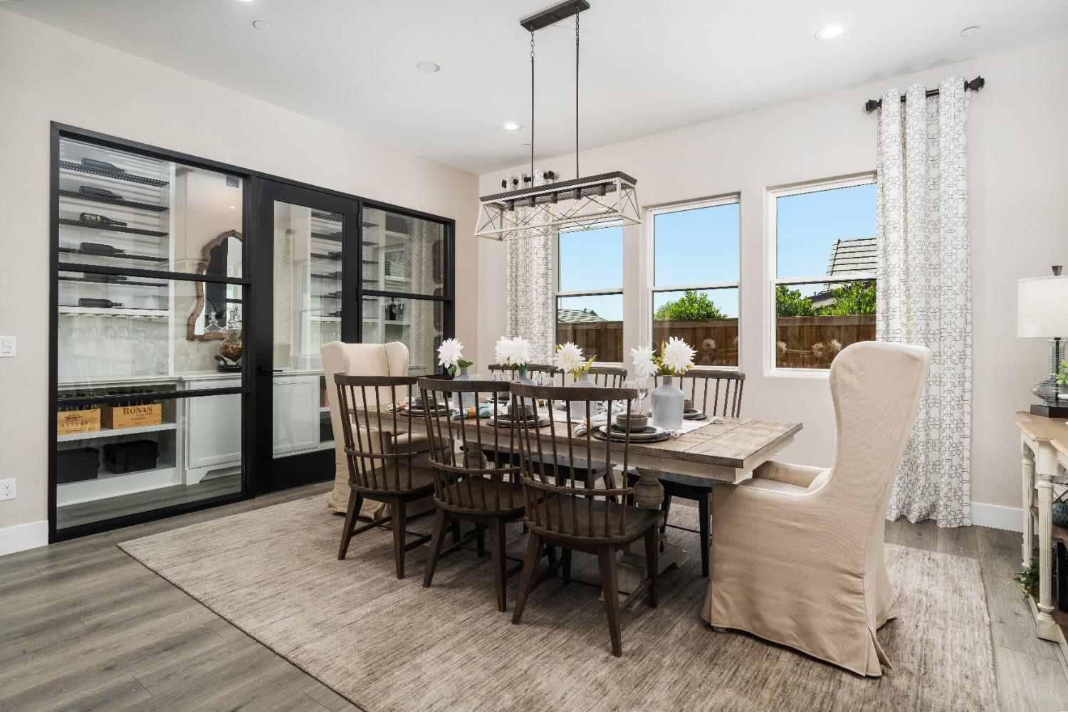 1754 Lester Avenue Clovis, CA 93619 - Photo 5 of 59 a dining room with furniture window and wooden floor
