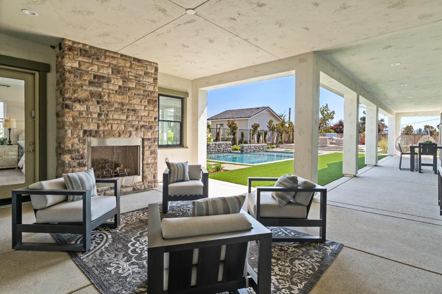 1754 Lester Avenue Clovis, CA 93619 - Photo 53 of 59 a living room with fireplace furniture and a large window