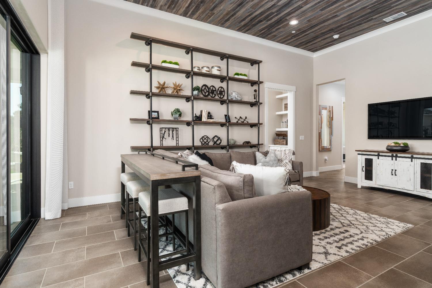 1754 Lester Avenue Clovis, CA 93619 - Photo 9 of 59 a living room with furniture and a flat screen tv