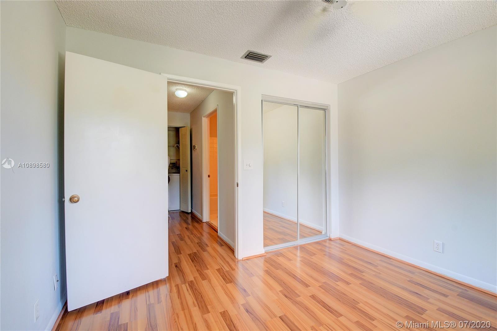 8617 Sunbird Place, Unit B Boca Raton, FL 33496 - Photo 11 of 41 a view of hallway with wooden floor