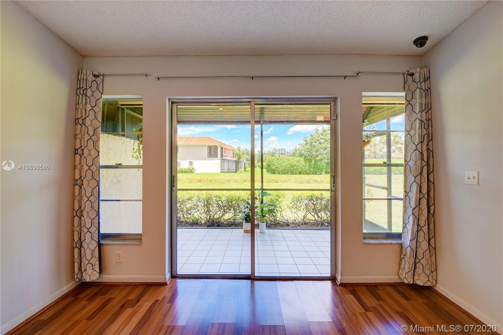 8617 Sunbird Place, Unit B Boca Raton, FL 33496 - Photo 16 of 41 a view of front door and deck