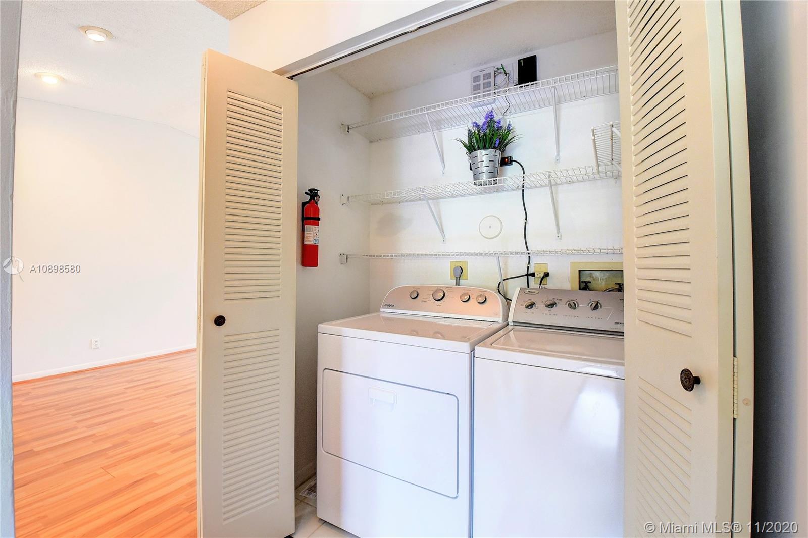 8617 Sunbird Place, Unit B Boca Raton, FL 33496 - Photo 18 of 41 a utility room with dryer and washer
