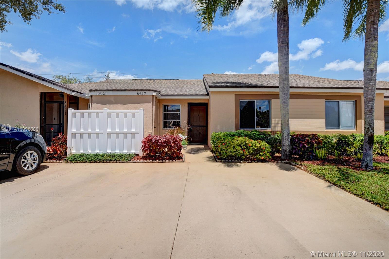 8617 Sunbird Place, Unit B Boca Raton, FL 33496 - Photo 21 of 41 a view of a house with a patio