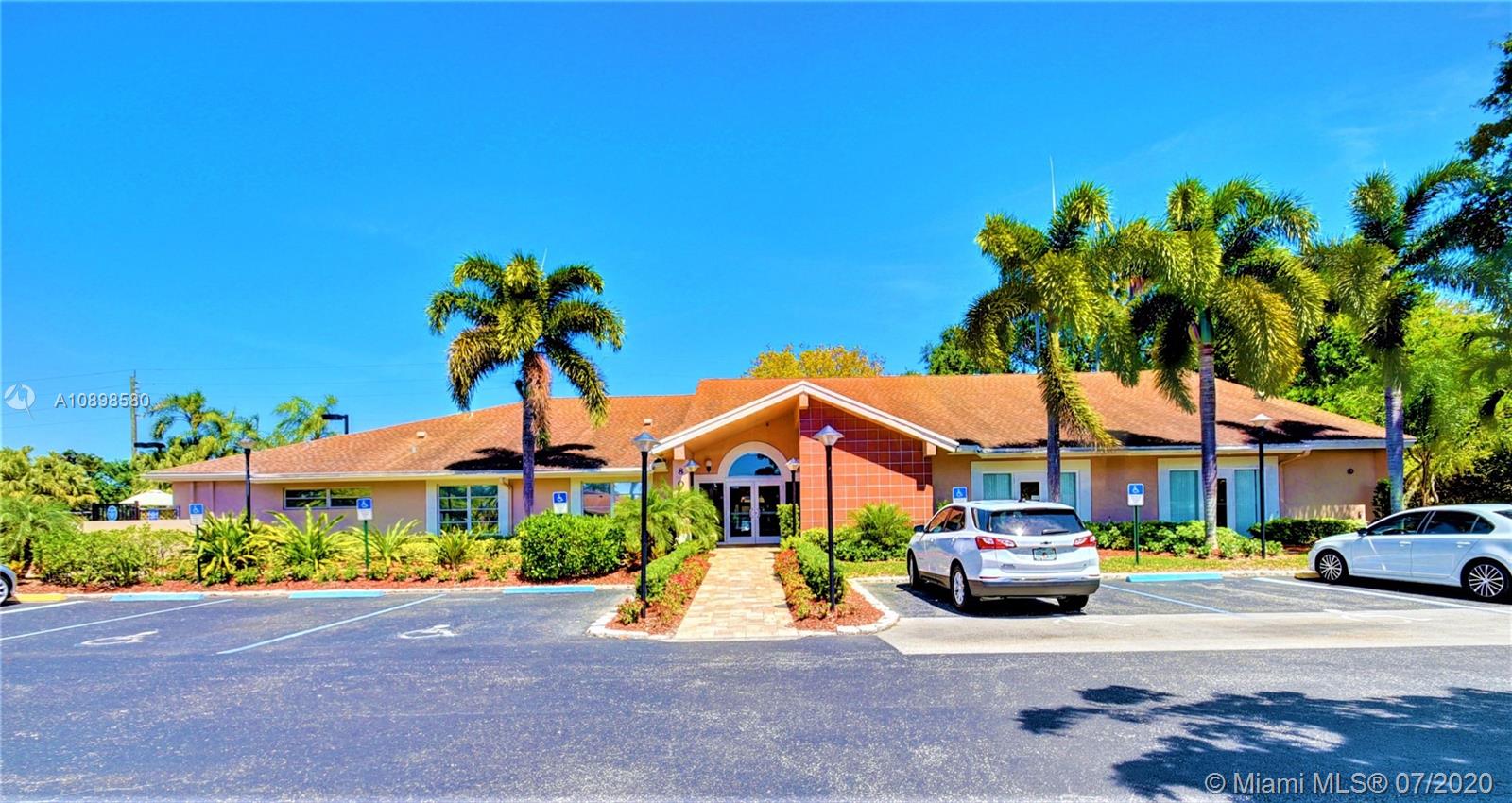 8617 Sunbird Place, Unit B Boca Raton, FL 33496 - Photo 22 of 41 a front view of a house with garden