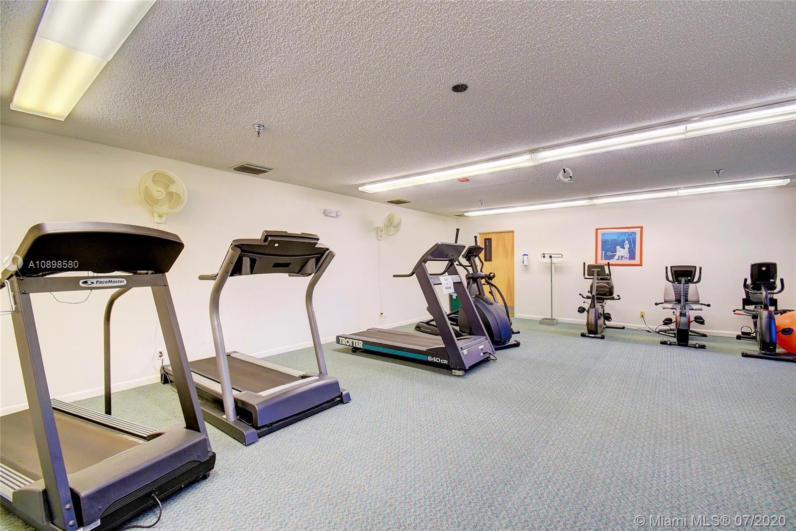 8617 Sunbird Place, Unit B Boca Raton, FL 33496 - Photo 26 of 41 a view of a room with gym equipment