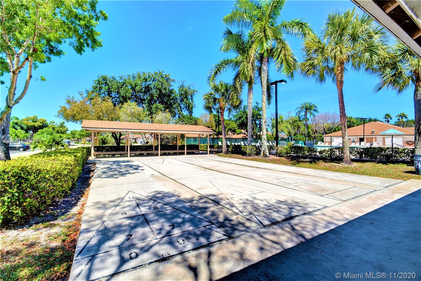 8617 Sunbird Place, Unit B Boca Raton, FL 33496 - Photo 33 of 41 a view of a house with palm trees