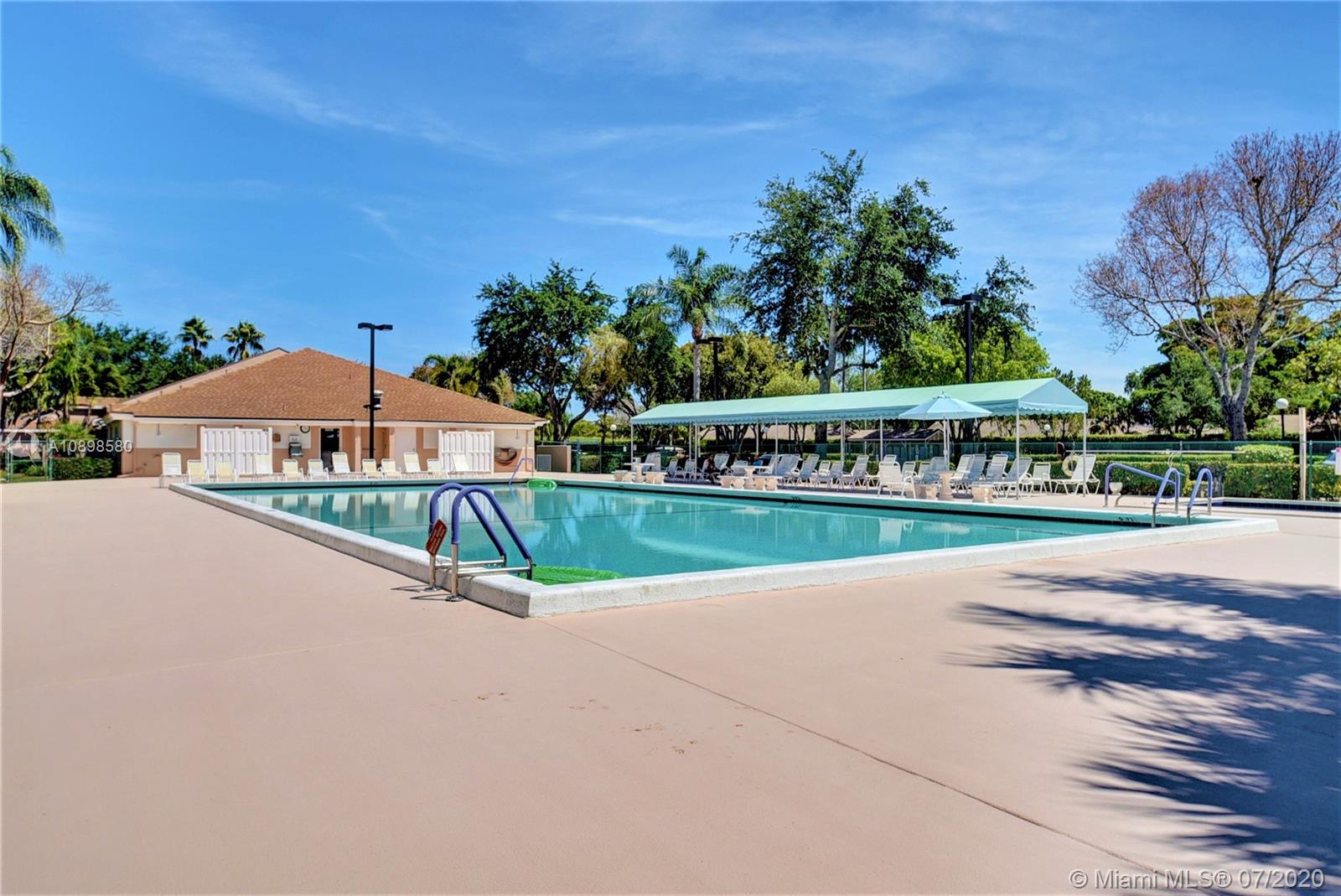 8617 Sunbird Place, Unit B Boca Raton, FL 33496 - Photo 34 of 41 a view of swimming pool and trees in the background
