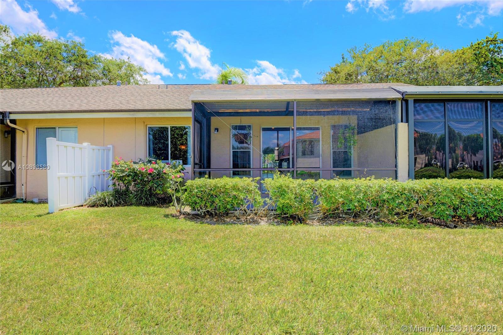 8617 Sunbird Place, Unit B Boca Raton, FL 33496 - Photo 37 of 41 a front view of a house with a yard