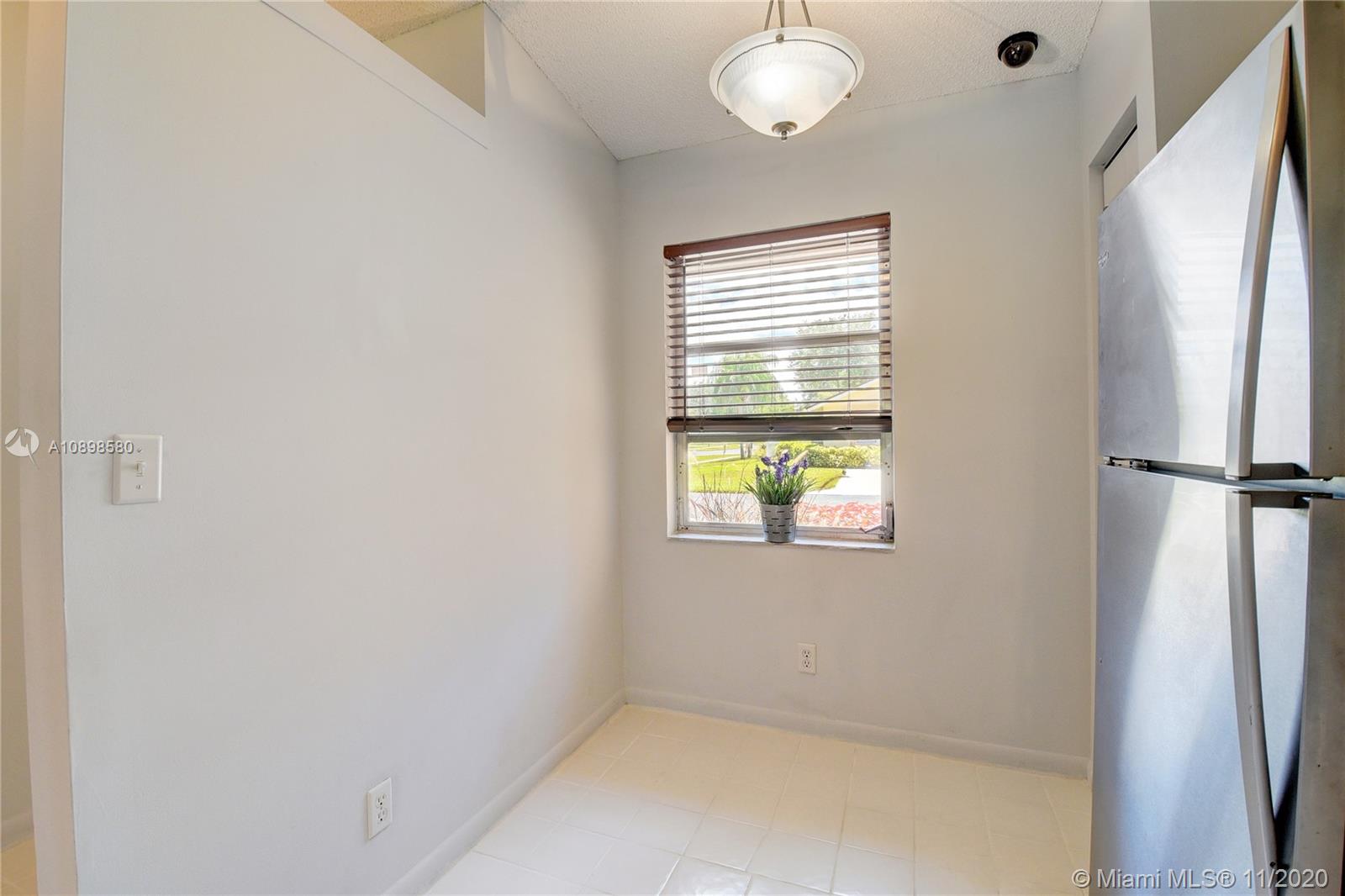 8617 Sunbird Place, Unit B Boca Raton, FL 33496 - Photo 7 of 41 a view of empty room with window
