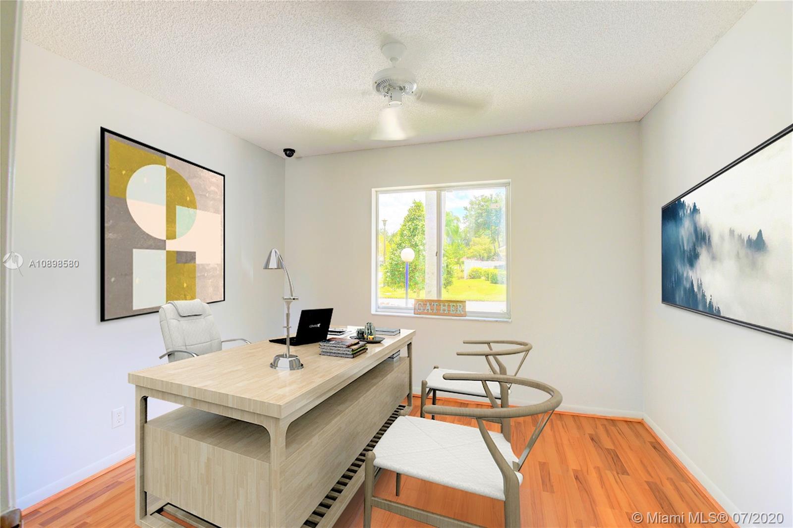8617 Sunbird Place, Unit B Boca Raton, FL 33496 - Photo 10 of 41 a dining room with a table and chairs