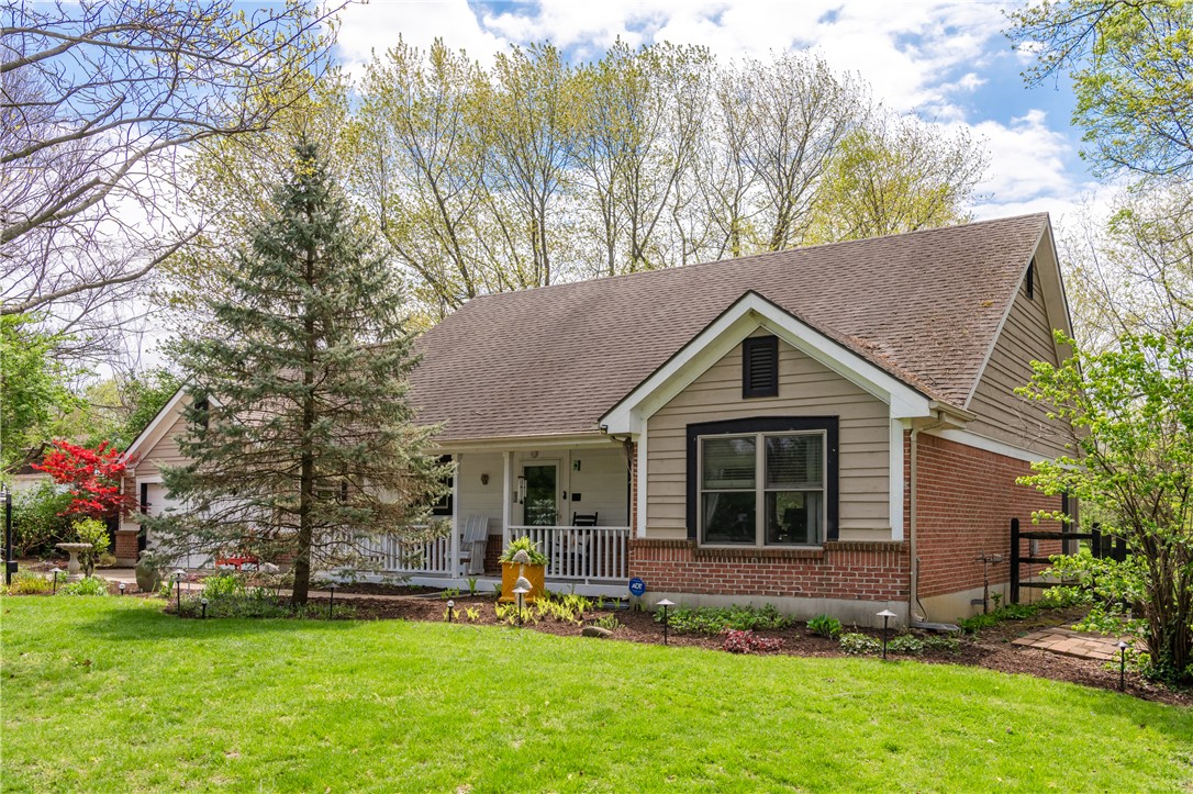 159 East Lytle 5 Points Road Springboro, OH 45066 - Photo 2 of 45 This charming home offers classic appeal with a welcoming front porch, nestled amidst mature trees and lush landscaping.