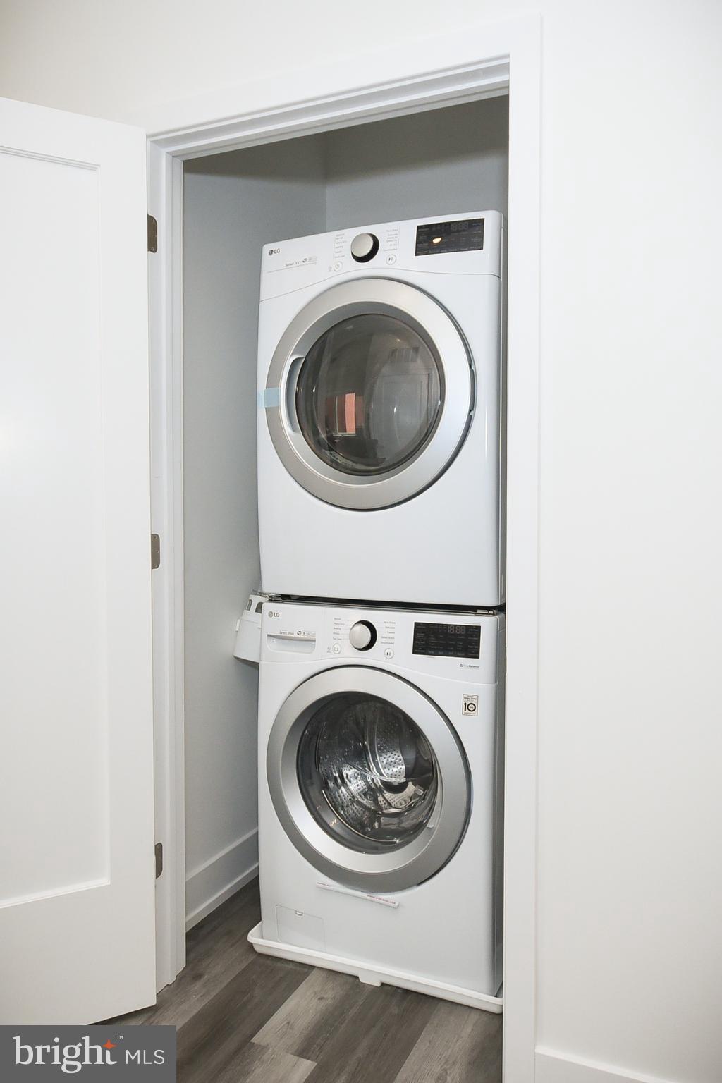 6164-66 Ridge Avenue, Unit 301 Philadelphia, PA 19128 - Photo 3 of 8 a utility room with dryer and washer