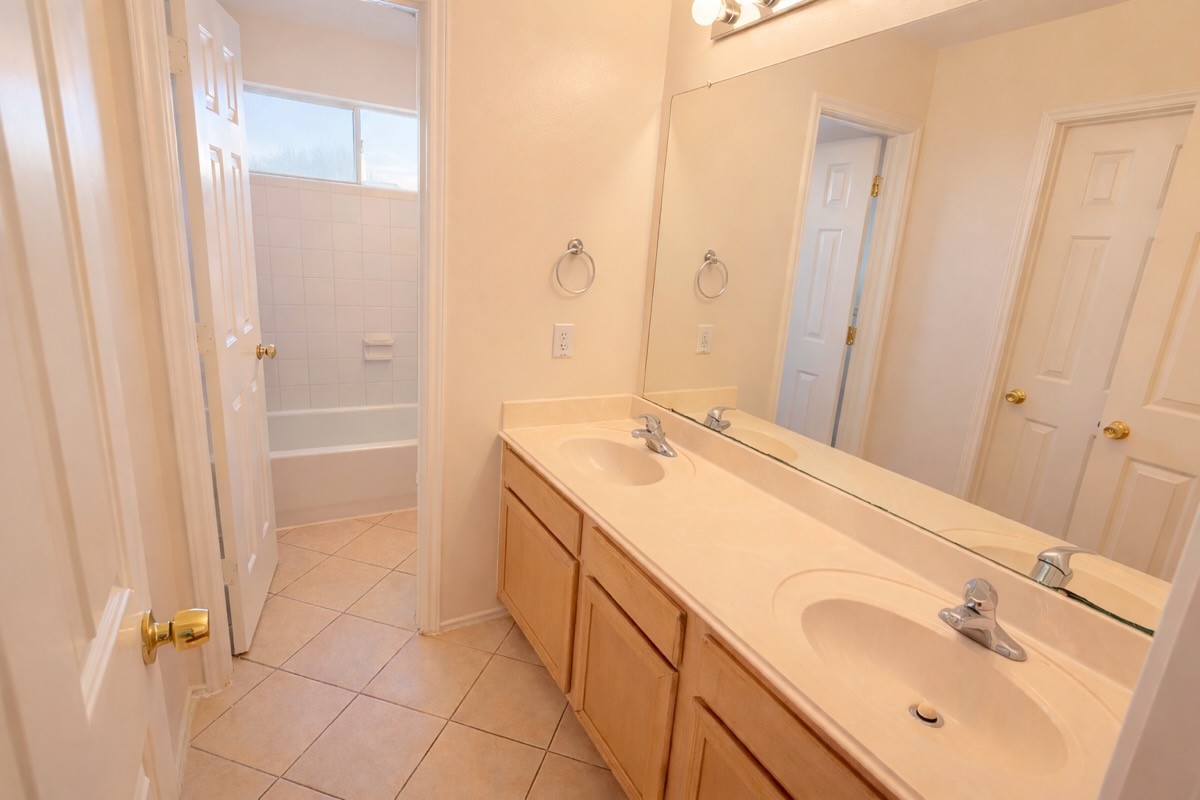 13131 Leader Trail Houston, TX 77072 - Photo 12 of 17 a bathroom with a sink and a mirror