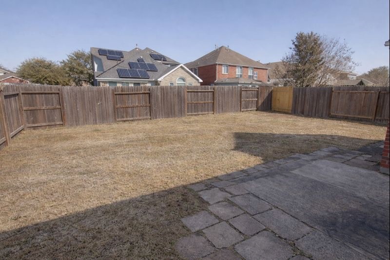 13131 Leader Trail Houston, TX 77072 - Photo 15 of 17 a front view of a house with a yard and garage