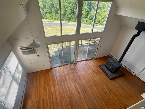 a view of an entryway with wooden floor