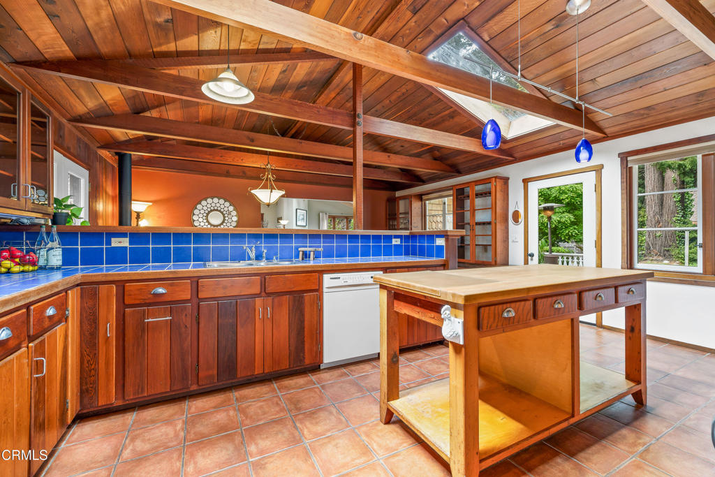 32450 Simpson Lane Fort Bragg, CA 95437 - Photo 16 of 54 a kitchen with stainless steel appliances granite countertop a stove a sink dishwasher and cabinets with wooden floor