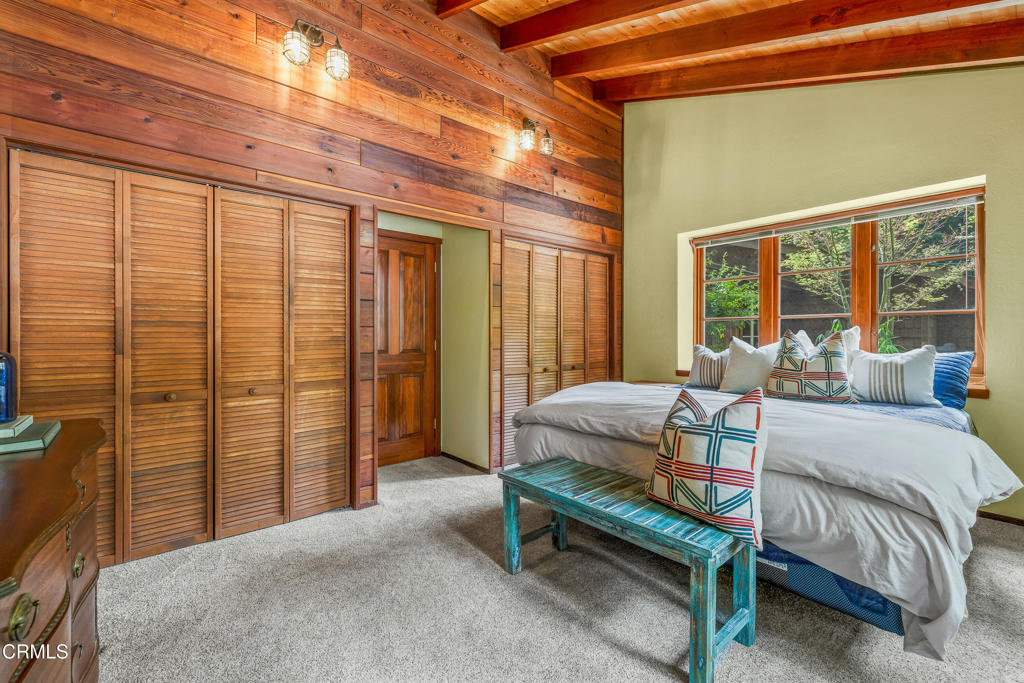 32450 Simpson Lane Fort Bragg, CA 95437 - Photo 19 of 54 a bedroom with furniture and large windows