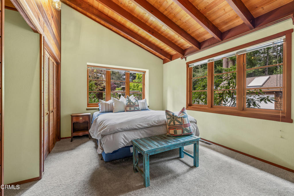 32450 Simpson Lane Fort Bragg, CA 95437 - Photo 20 of 54 a bed sitting in a spacious bedroom next to a window