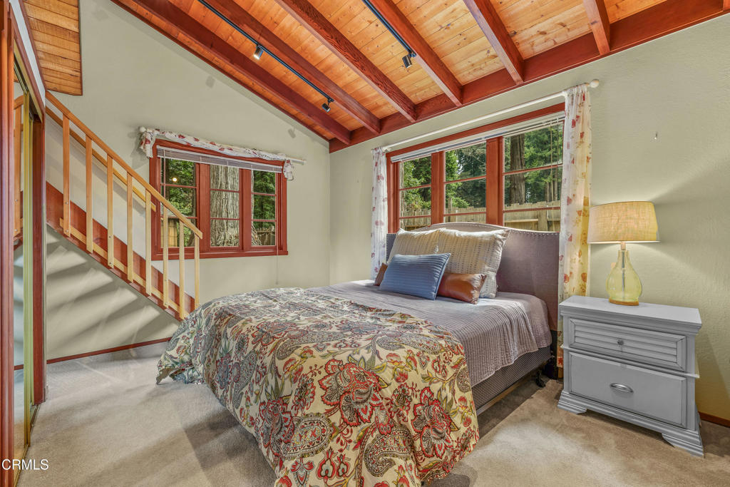 32450 Simpson Lane Fort Bragg, CA 95437 - Photo 22 of 54 a bedroom with a bed and a window