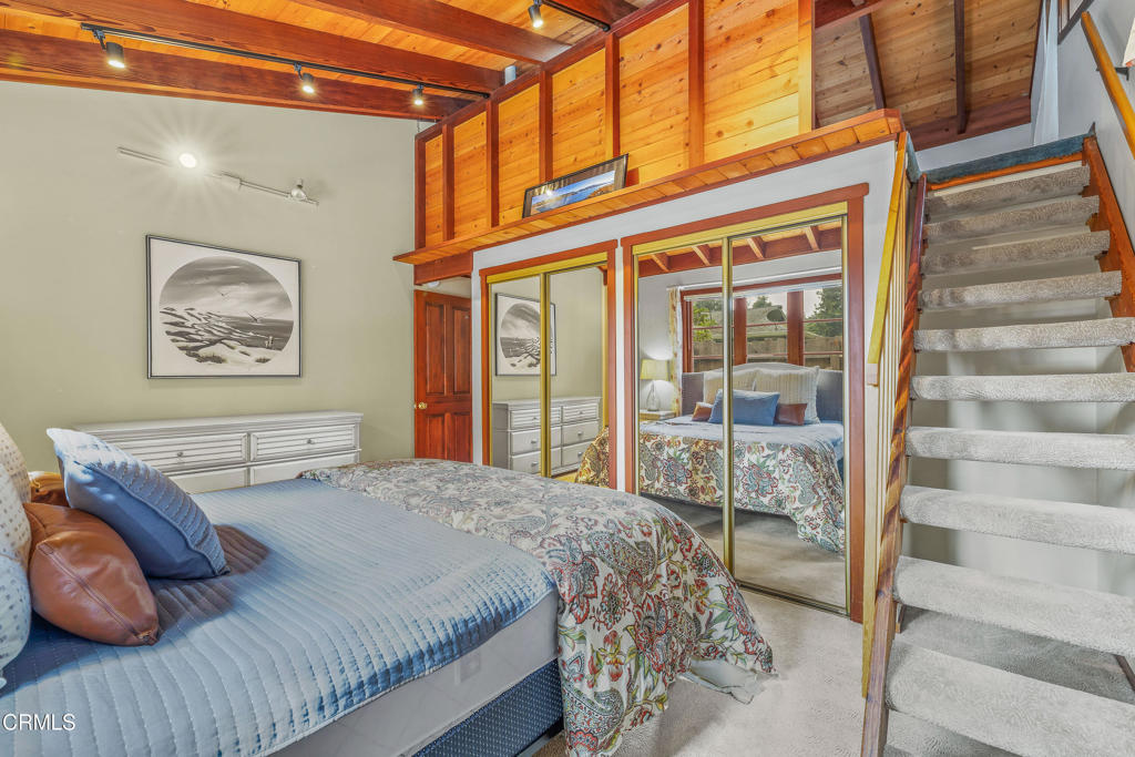 32450 Simpson Lane Fort Bragg, CA 95437 - Photo 23 of 54 a bedroom with a bed and a large window