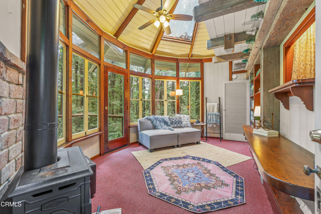 32450 Simpson Lane Fort Bragg, CA 95437 - Photo 31 of 54 a living room with large windows