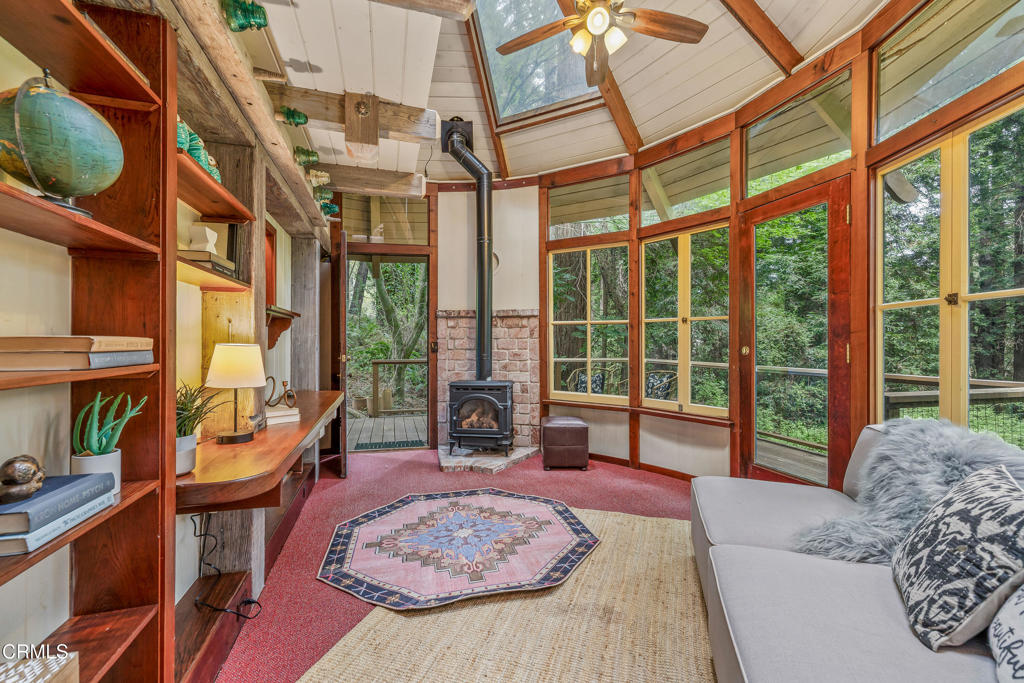 32450 Simpson Lane Fort Bragg, CA 95437 - Photo 32 of 54 a living room with furniture and a large window